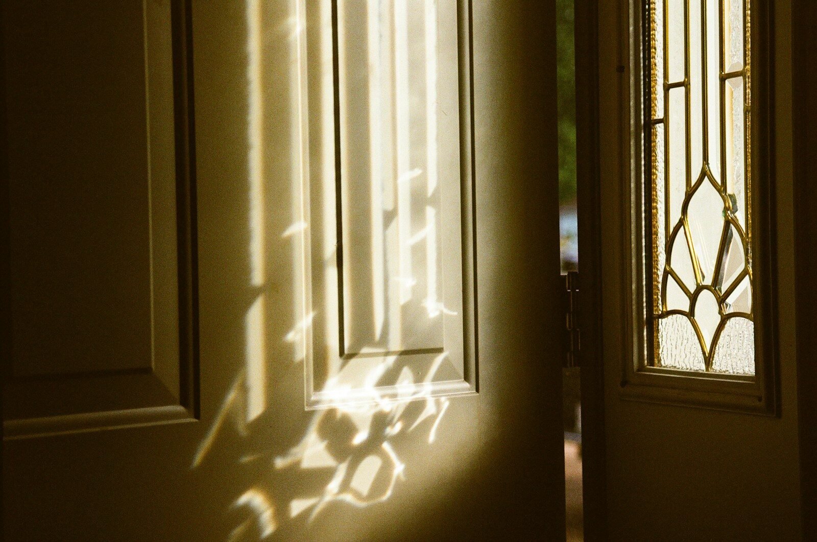 white wooden door with glass