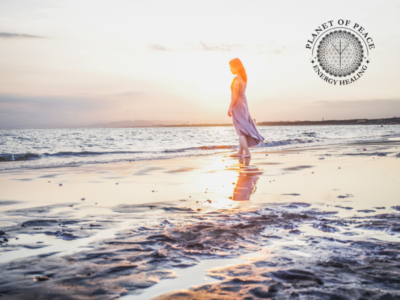 Woman grounding in lake, symbolizing emotional release and inner peace